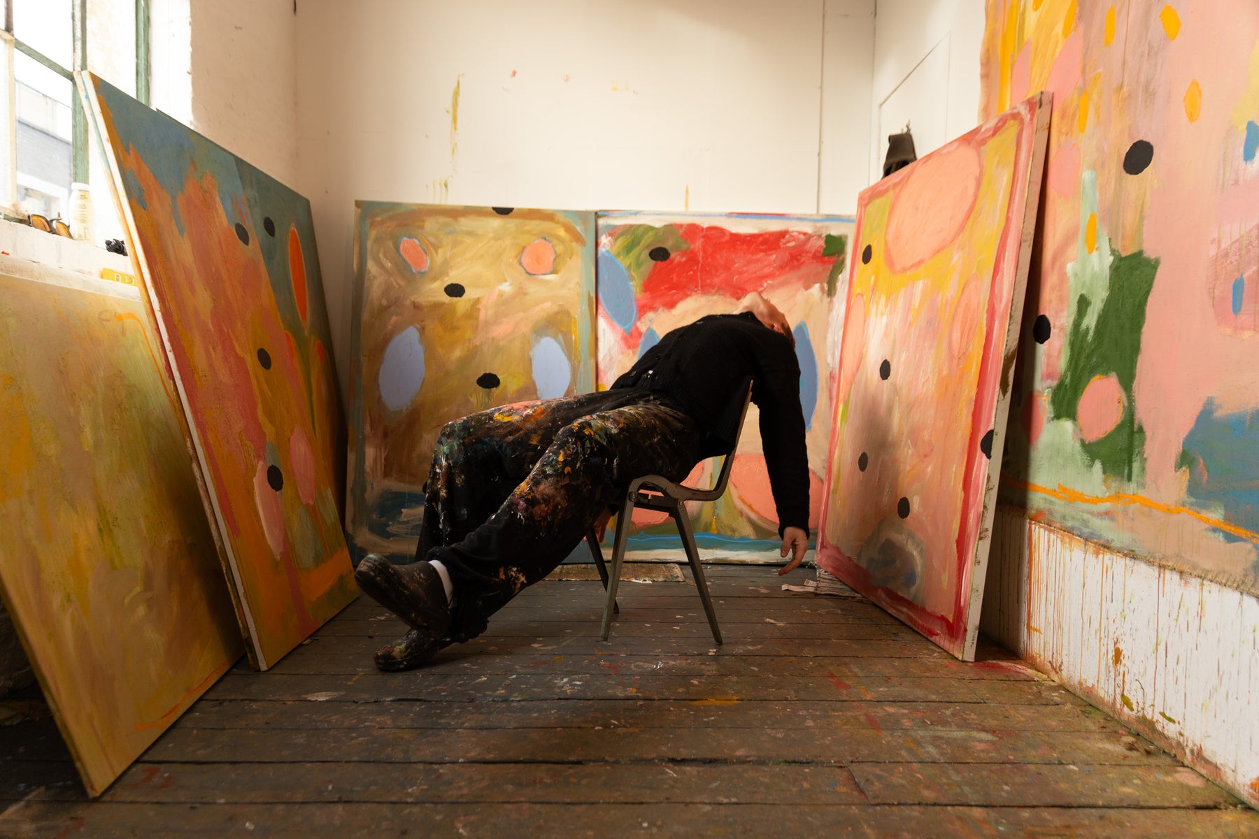 Leevar Spies studio with paintings